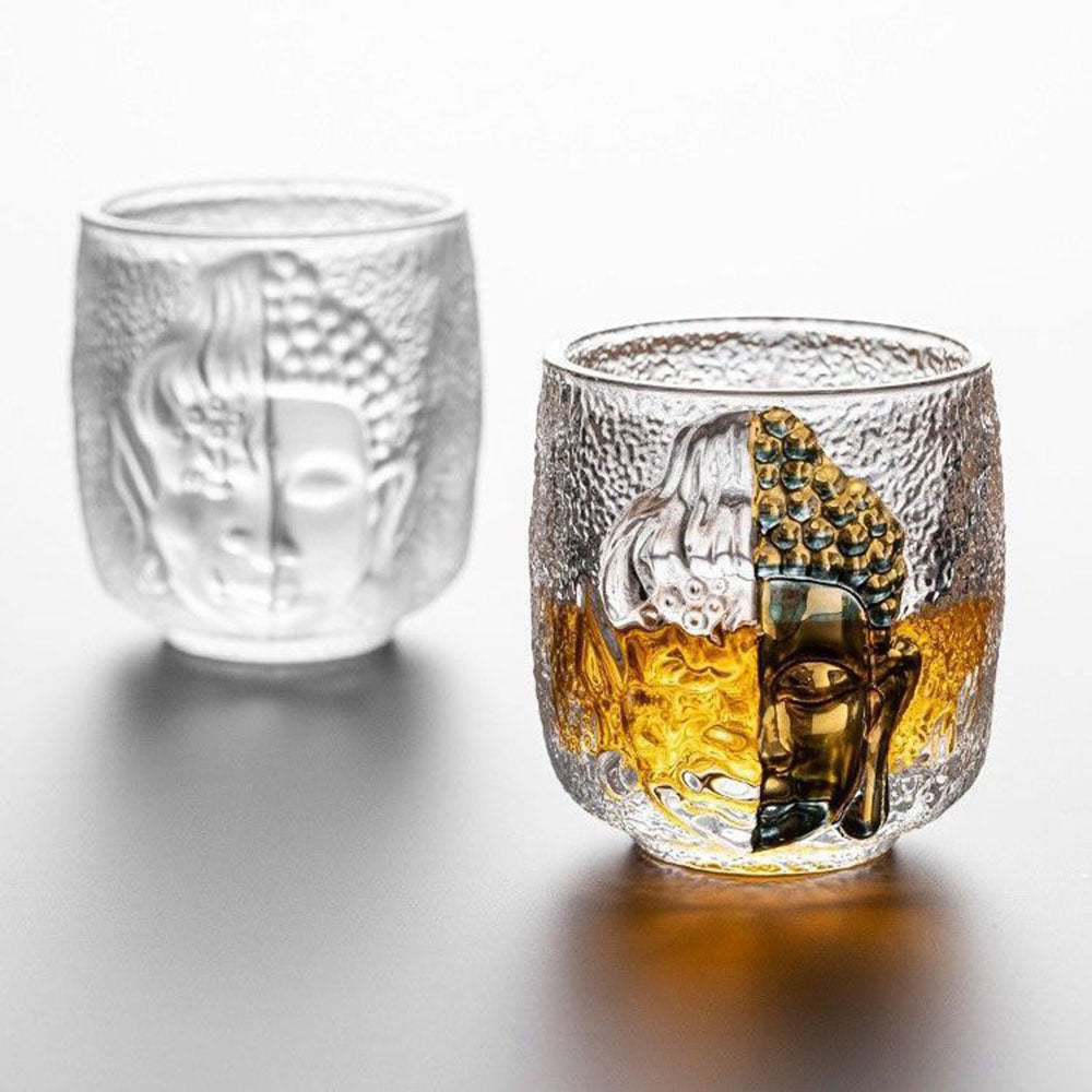 Angled view of the Buddha-inspired glass tea cup showing its elegant curves and clear texture