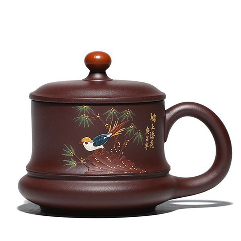 Yixing purple clay bird tea cup showcasing floral design and yellow bead lid.