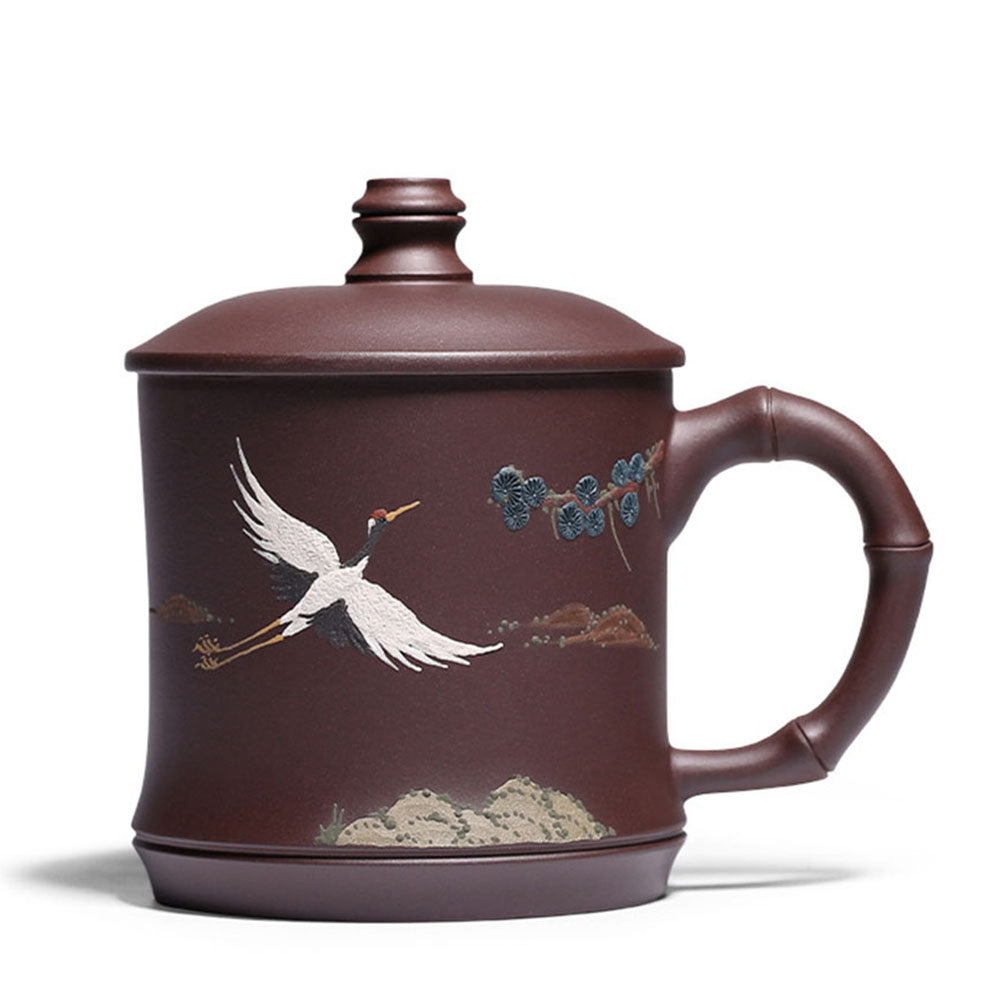 Top-down view of the purple clay teacup with crane and pine design, showcasing traditional chinese tea ware craftsmanship
