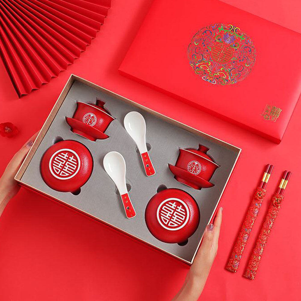 Close-up of the ceramic wedding tea set with double happiness design, showcasing gaiwans and bowls.