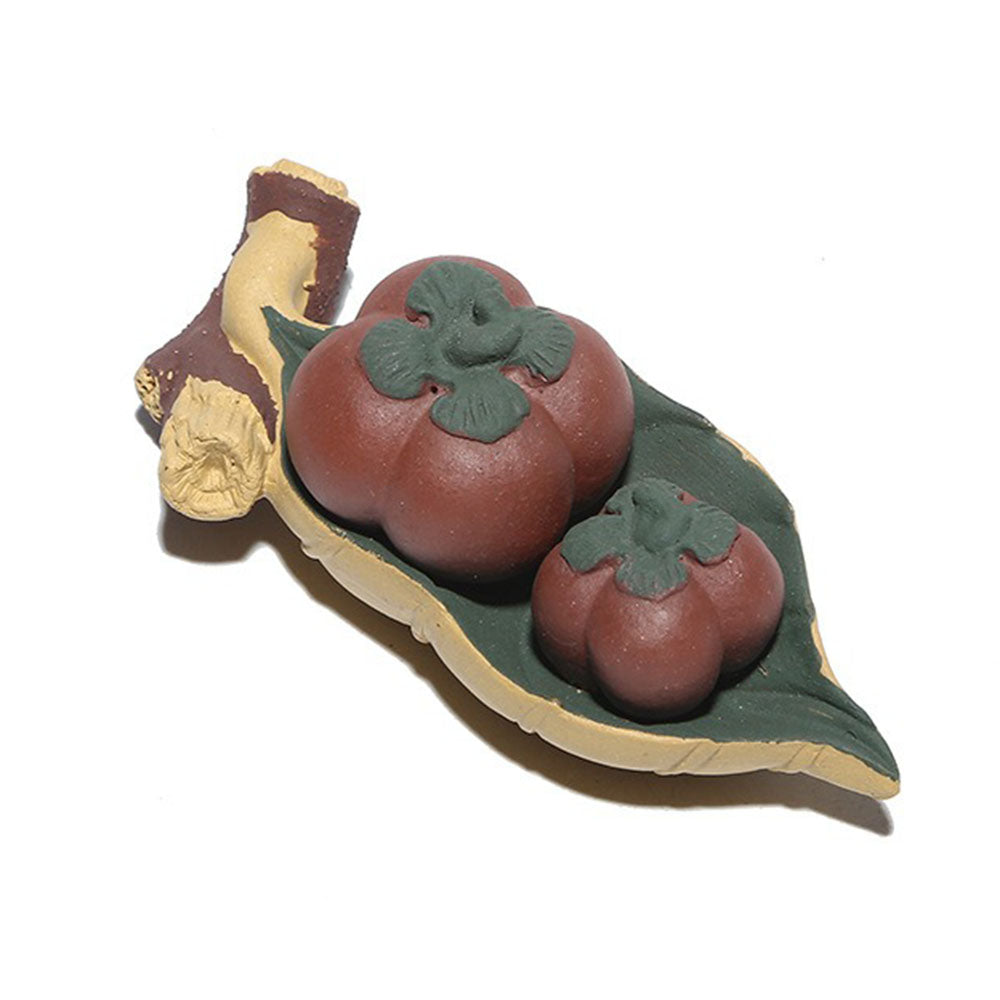 Yixing clay persimmons tea pet on a tea tray, detailed craftsmanship