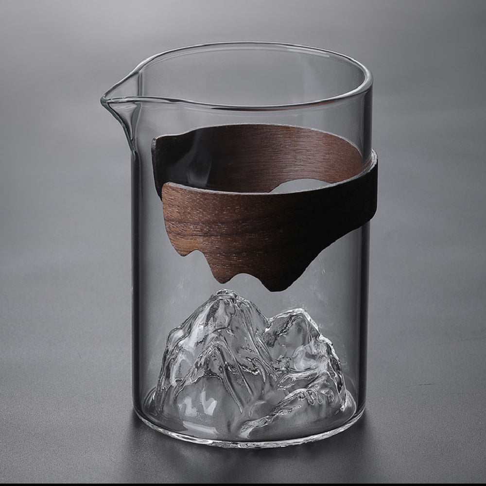Close-up of large glass tea mug with bamboo handle showing its elegant design