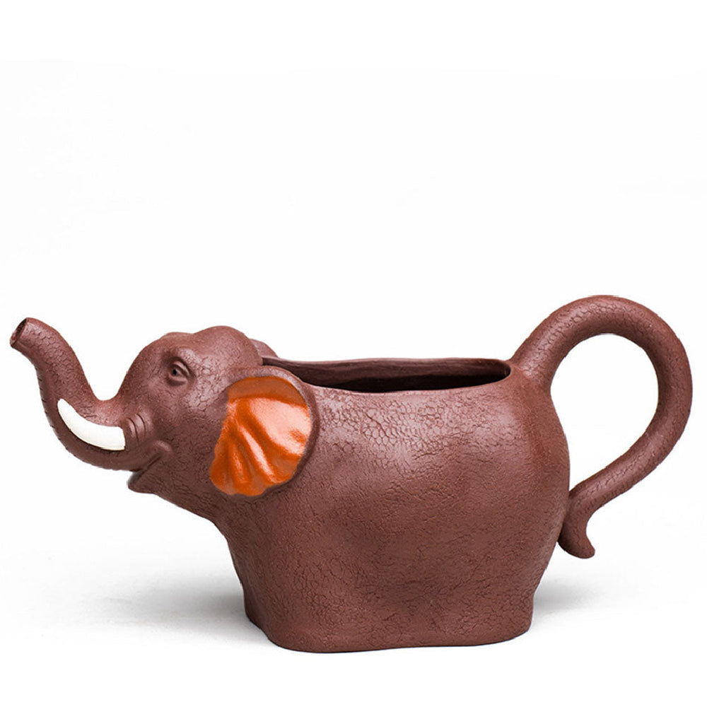 Close-up of handmade Yixing clay elephant tea cup showing detailed elephant design