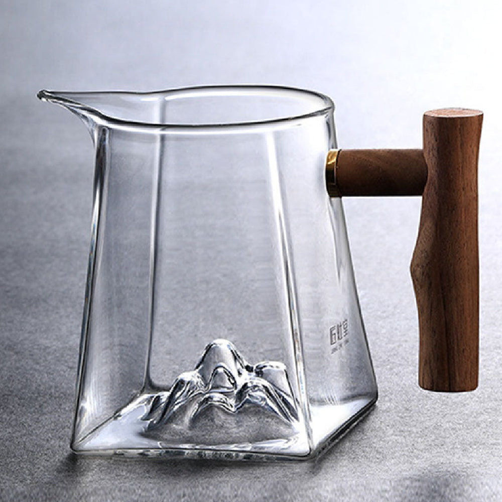 Front view of large glass tea cup with wooden handle for gifting