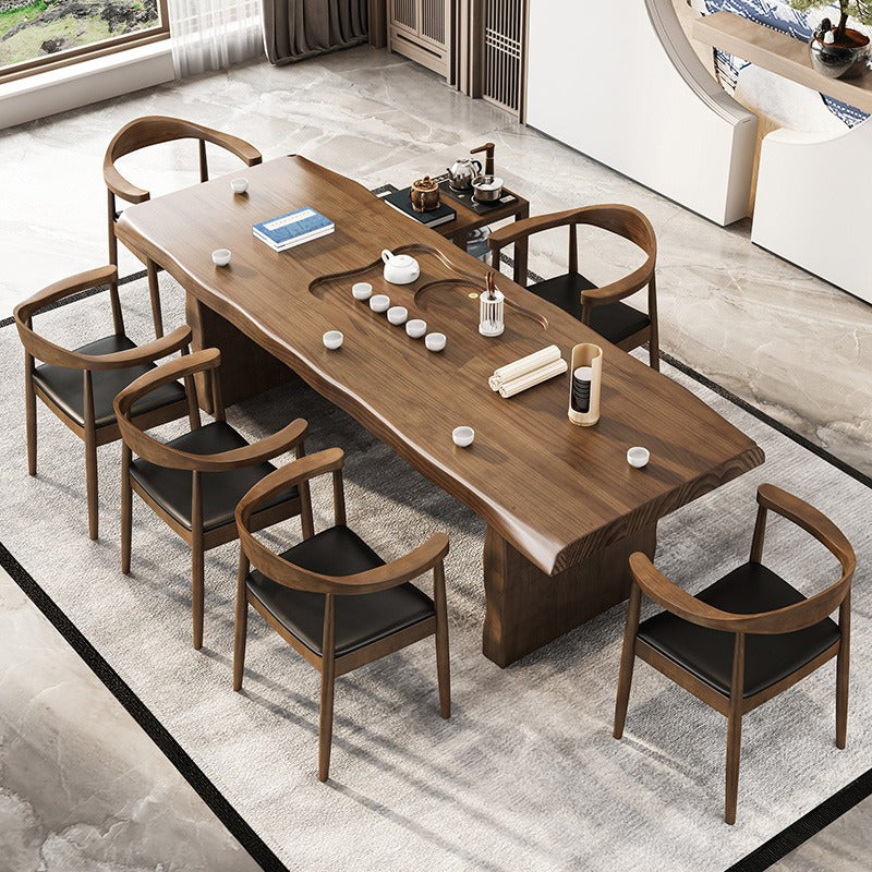 Front view of handcrafted Chinese tea furniture set with solid wood table and leather chairs