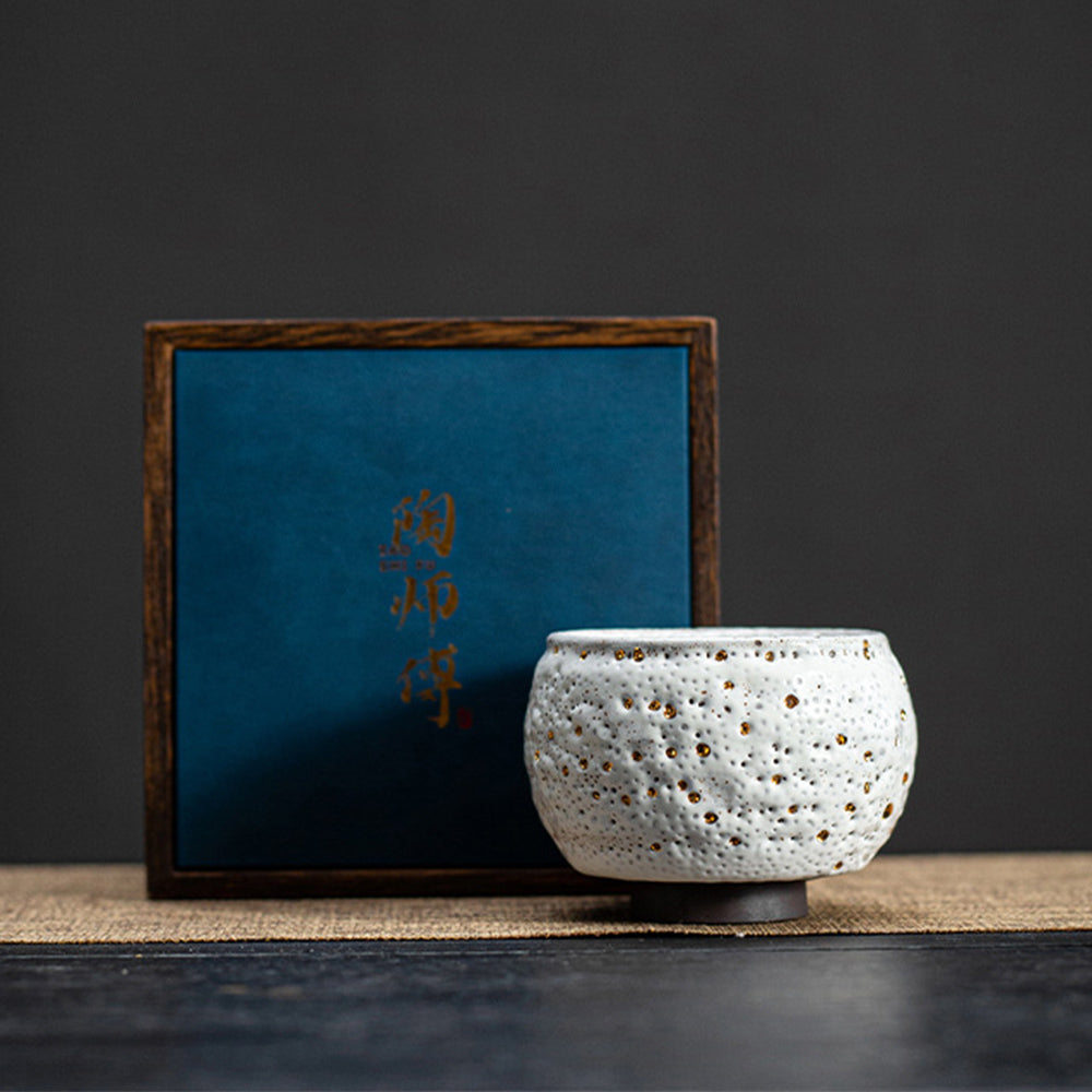 Elegant gold dotted gongfu tea cup showcasing intricate design and craftsmanship.