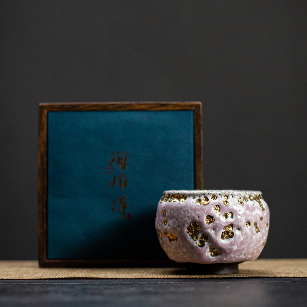 Elegant pink glazed gongfu tea cup displayed in a gift box, showcasing its handcrafted details.
