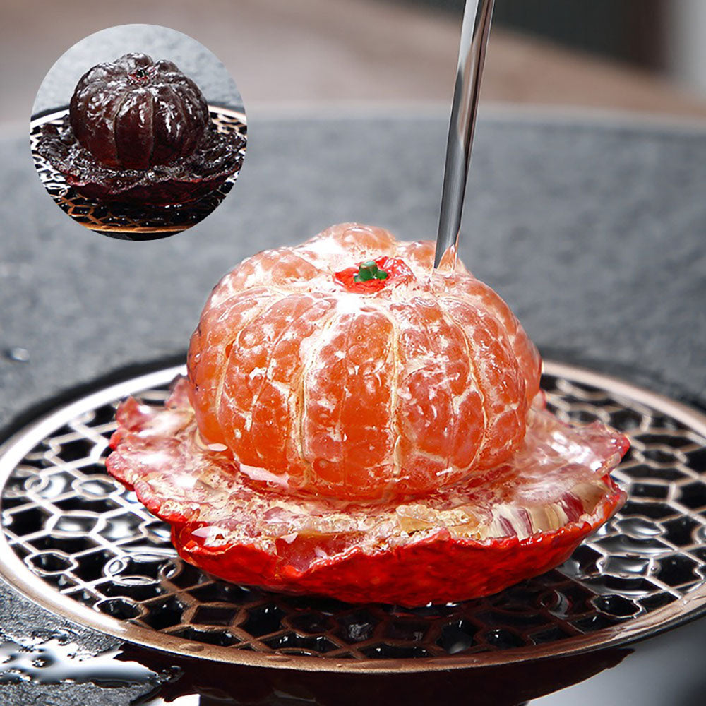 Close-up view of the enchanting color-changing orange tea pet figurine showcasing its intricate details.