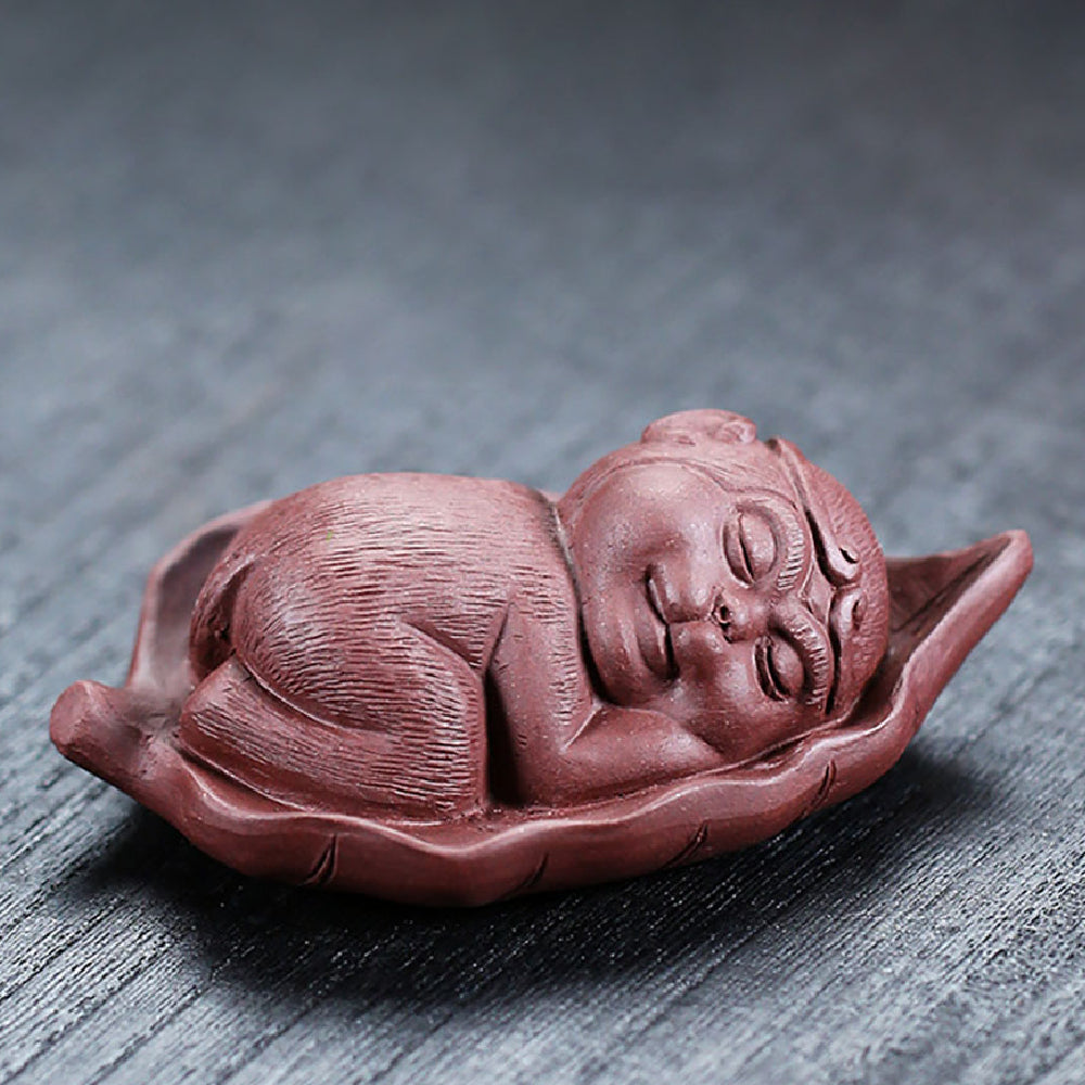 Charming Monkey Tea Pet on Bodhi Leaf, showcasing its intricate design and lifelike features.