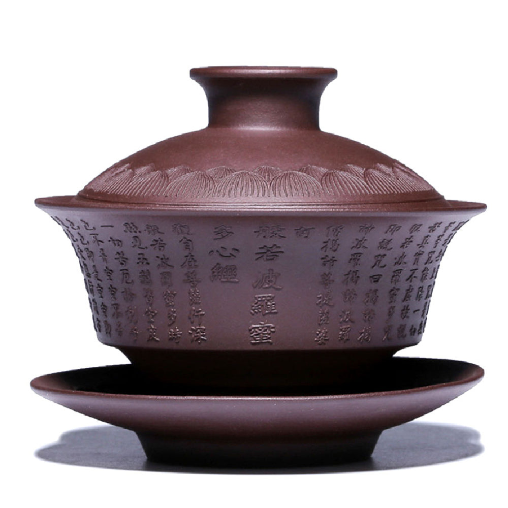 Close-up of the Heart Sutra Yixing clay gaiwan highlighting its engraved design.