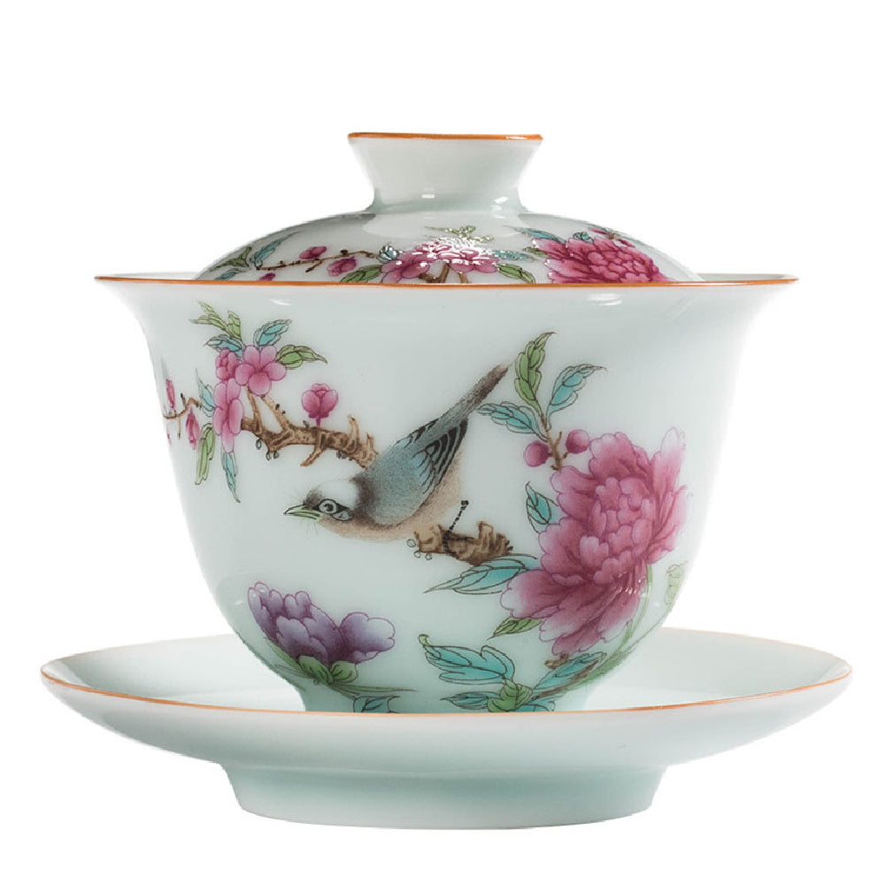 Floral design hand-painted gaiwan with gold accents, perfect for tea brewing.