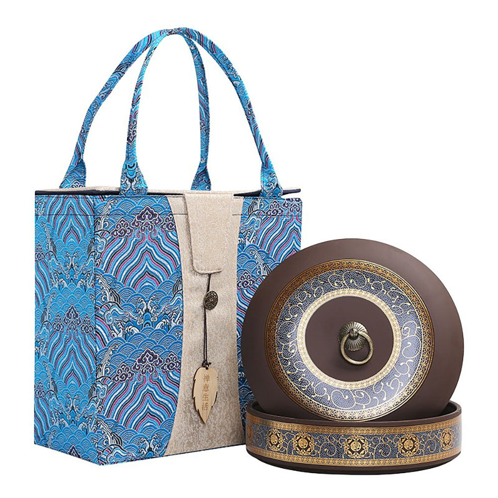 Elegant Yixing clay tea caddy showcasing its gold-painted floral design from an angled view.