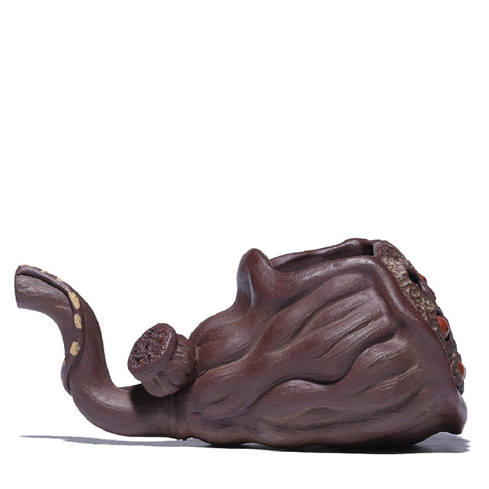 Side view of the Yixing lotus seedpod fair cup showing its handcrafted outlet stem