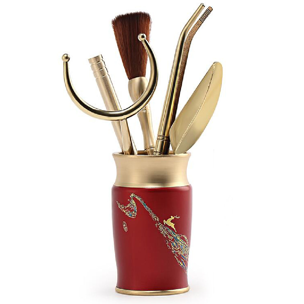 Close-up of colorful copper tea tools for Gong fu tea ceremony