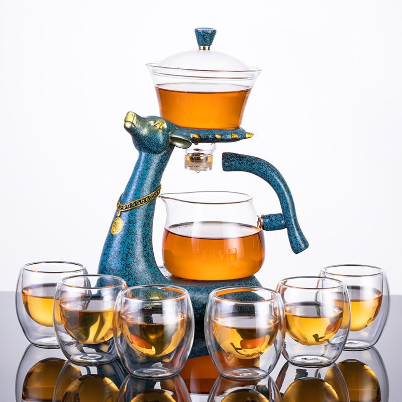 Elegant automatic glass teapot showcasing tea leaves in action.