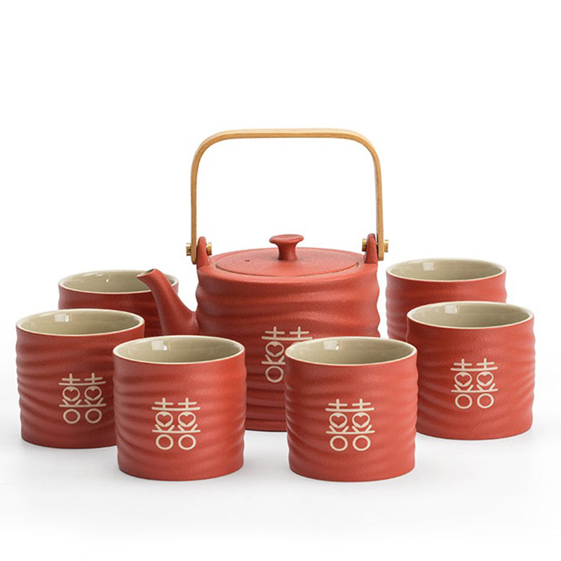 Ceramic wedding tea set with wooden tray on a traditional wedding table