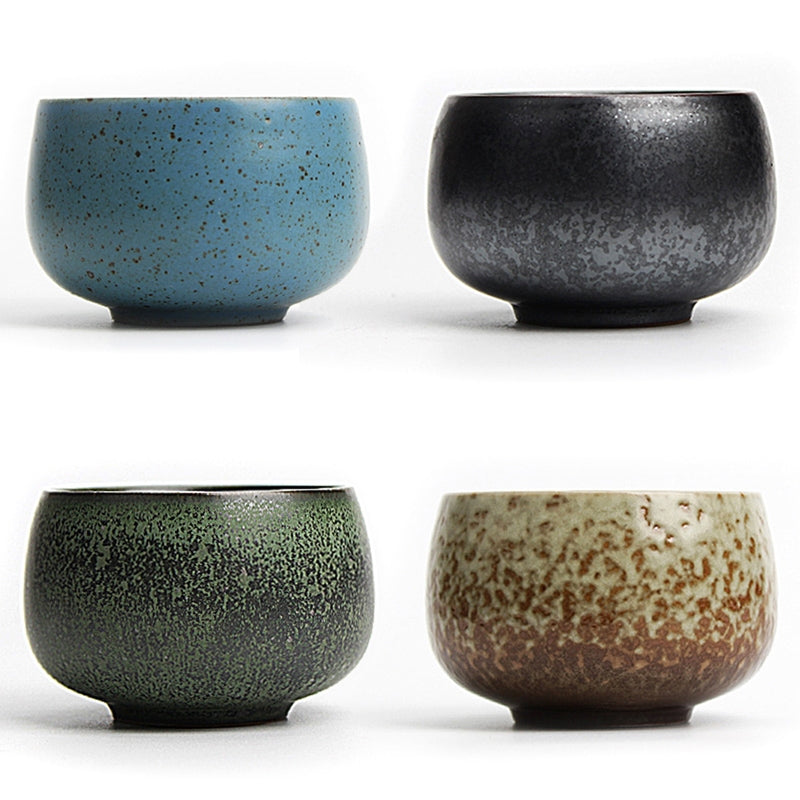 Lava stone zen gongfu tea cups set on a wooden table, highlighting the textured surface and elegant design