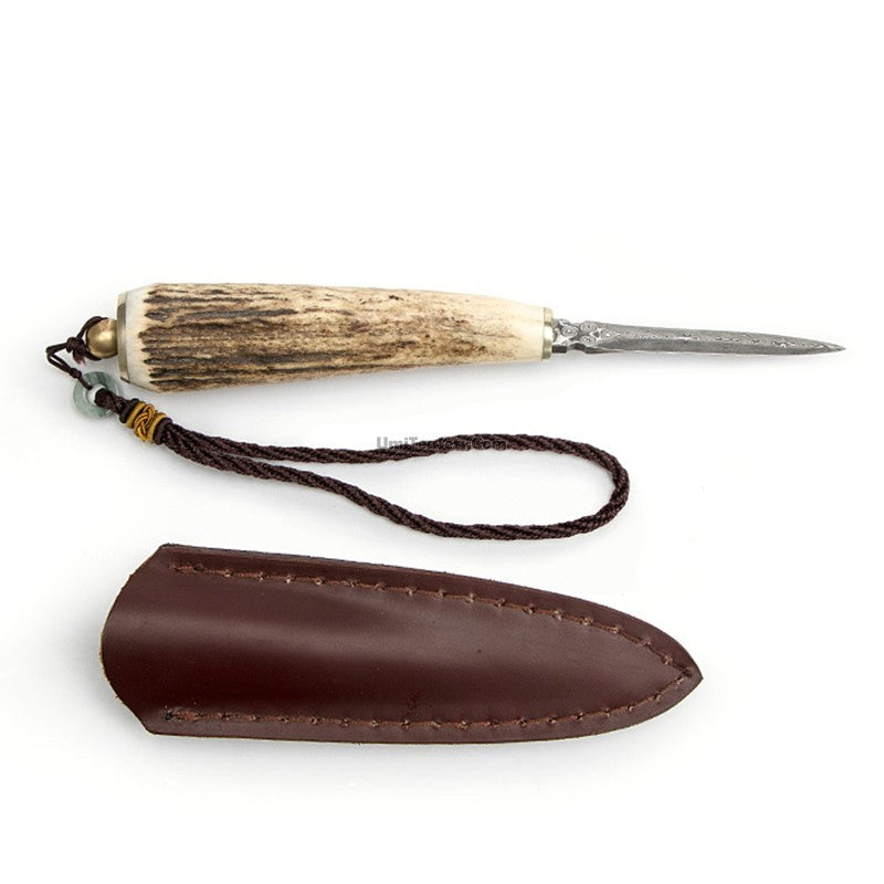 Close-up of handcrafted poplar wood tea knife with leather case for prying compressed tea