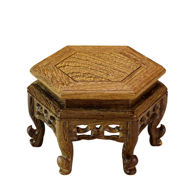 Close-up of the elegant hexagonal solid wood teapot stand showcasing its smooth surface