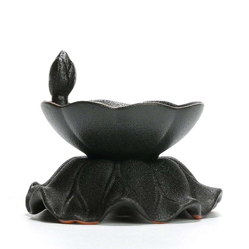 Vintage coarse pottery tea strainer on a tea cup for loose leaf tea filtration