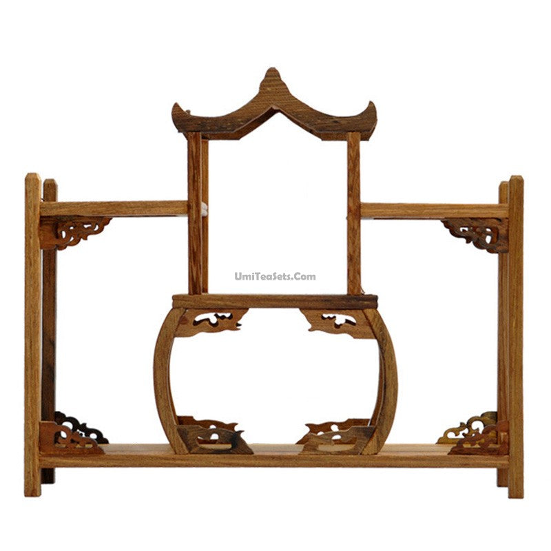 Elegant wenge tea display stand with a traditional tea set beautifully arranged.