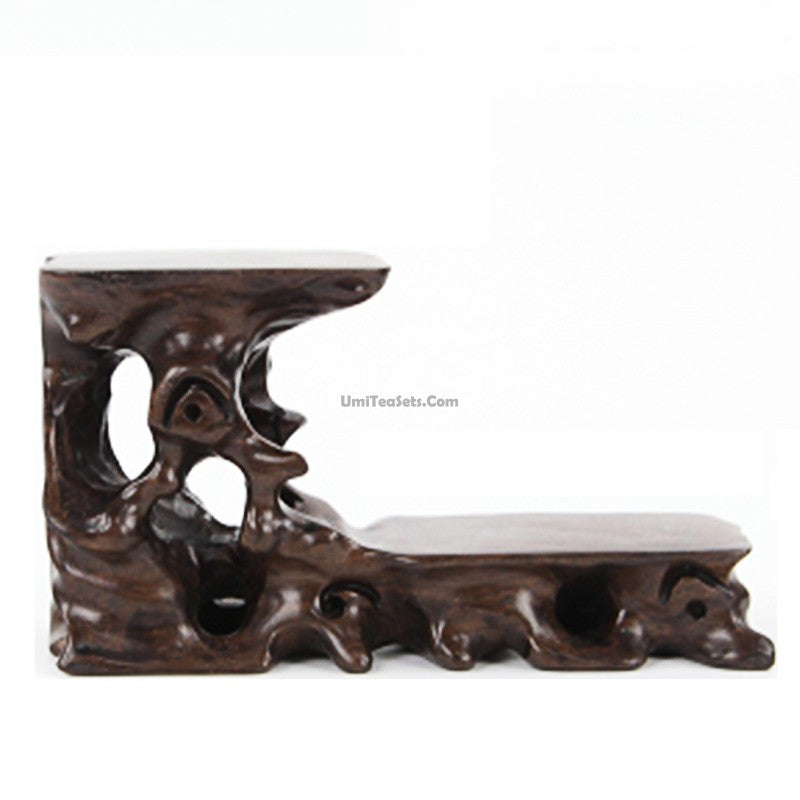Artistic rosewood teapot stand with carved patterns, perfect for elegant tea service
