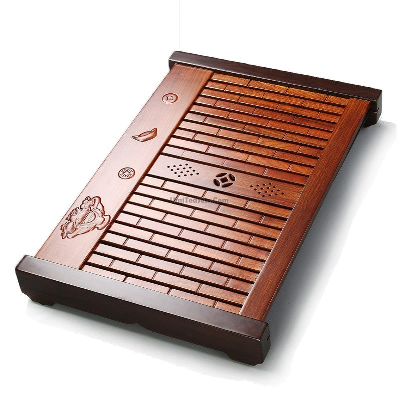 Top-down view of the rosewood tea tray with tea accessories arranged for brewing gongfu-style tea