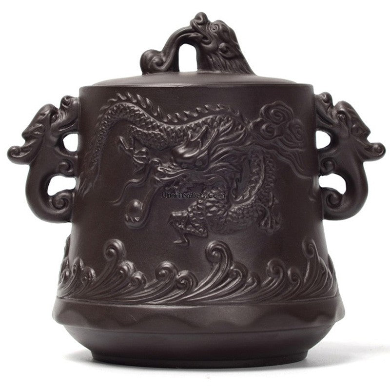 Elegant purple clay tea caddy showcasing its airtight design, perfect for loose leaf tea storage.