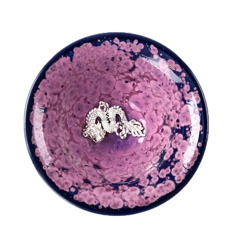 Side view of the elegant handmade Jianzhan purple tea cup showcasing sterling silver interior.