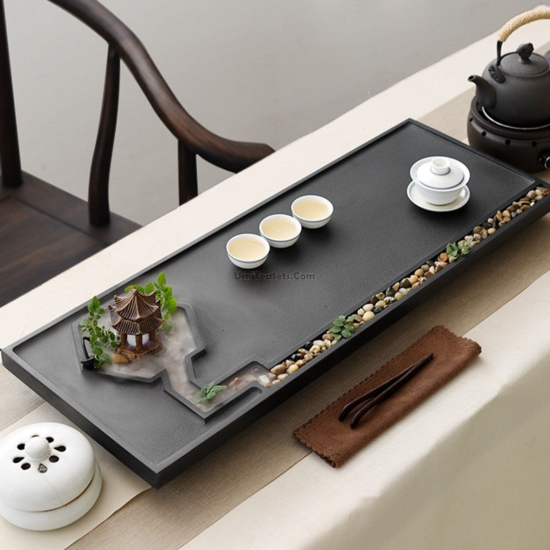 Black Stone Zen Gongfu Tea Tray showcasing an elegant tea set in use.