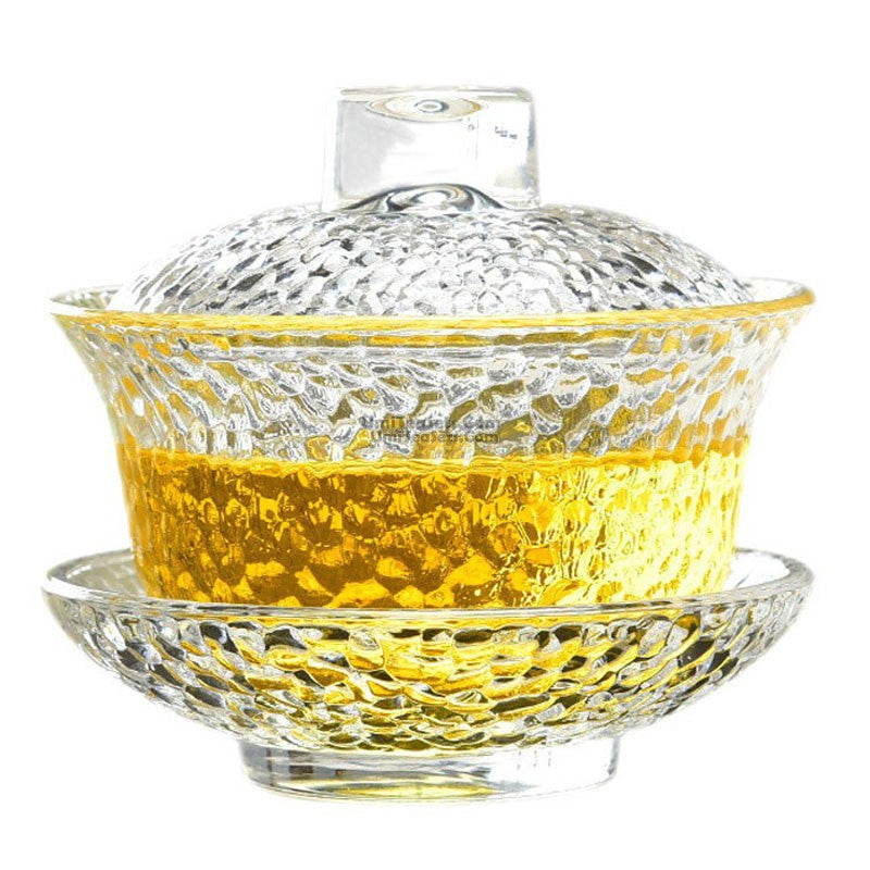 Elegant crystal glass gaiwan with lid and saucer, perfect for tea brewing.