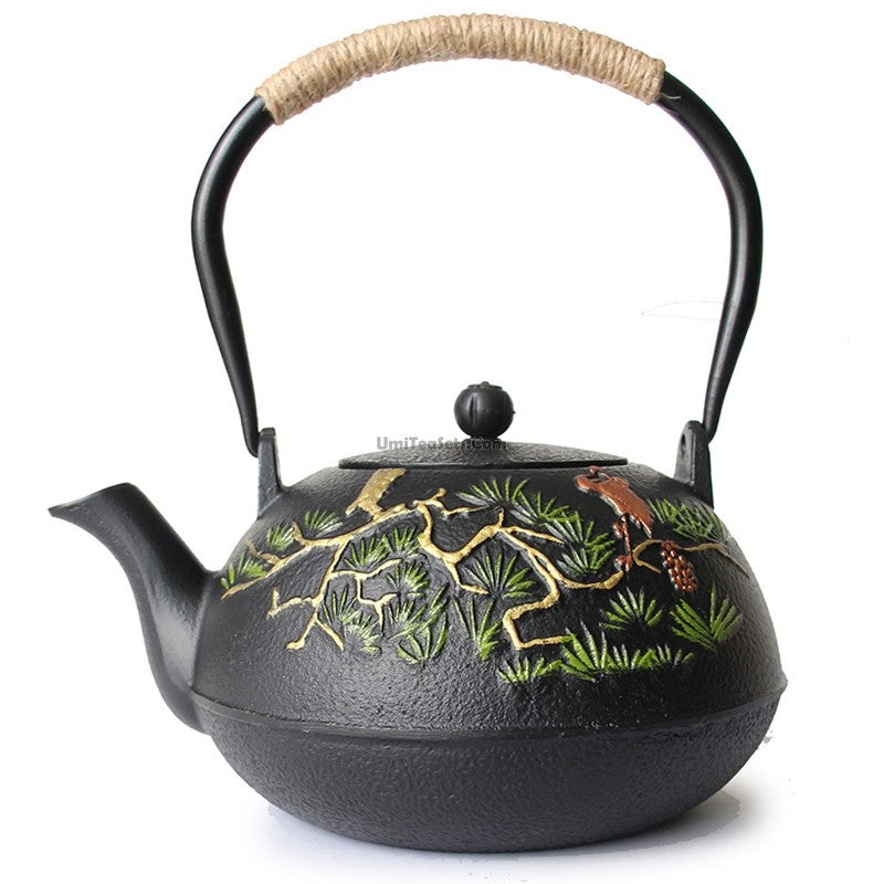Side view of the Pine Harmony Cast Iron Teapot highlighting its elegant engraving and sturdy handle.