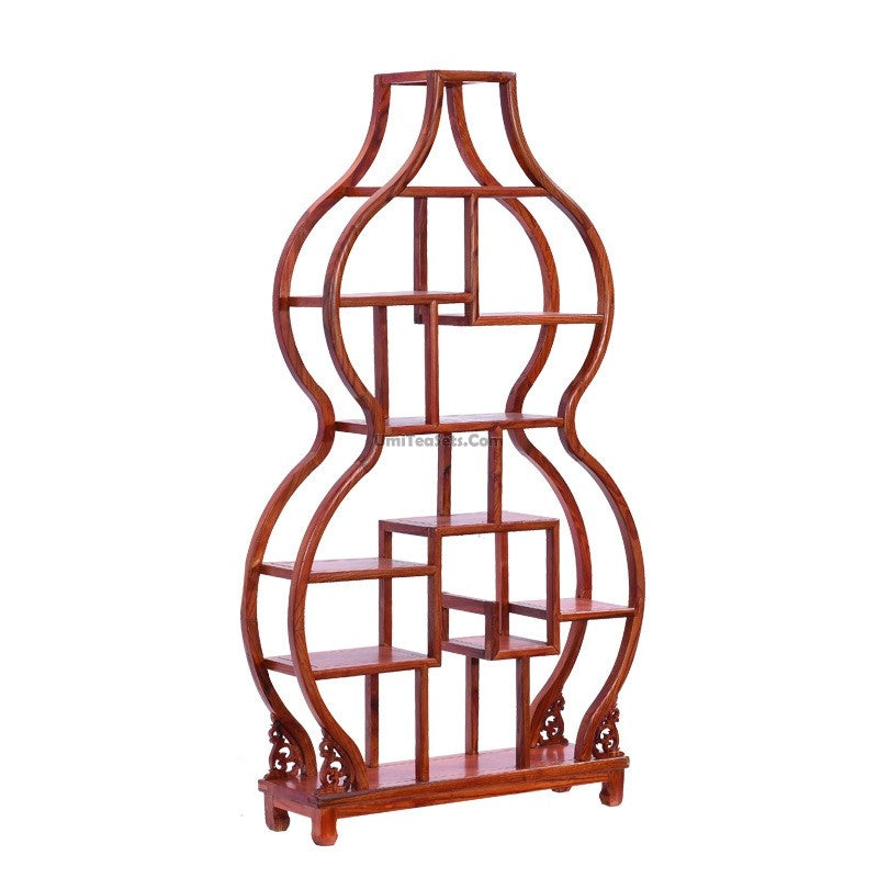 Gourd shaped Chinese curio cabinet showcasing tea sets and collectibles in a stylish living room