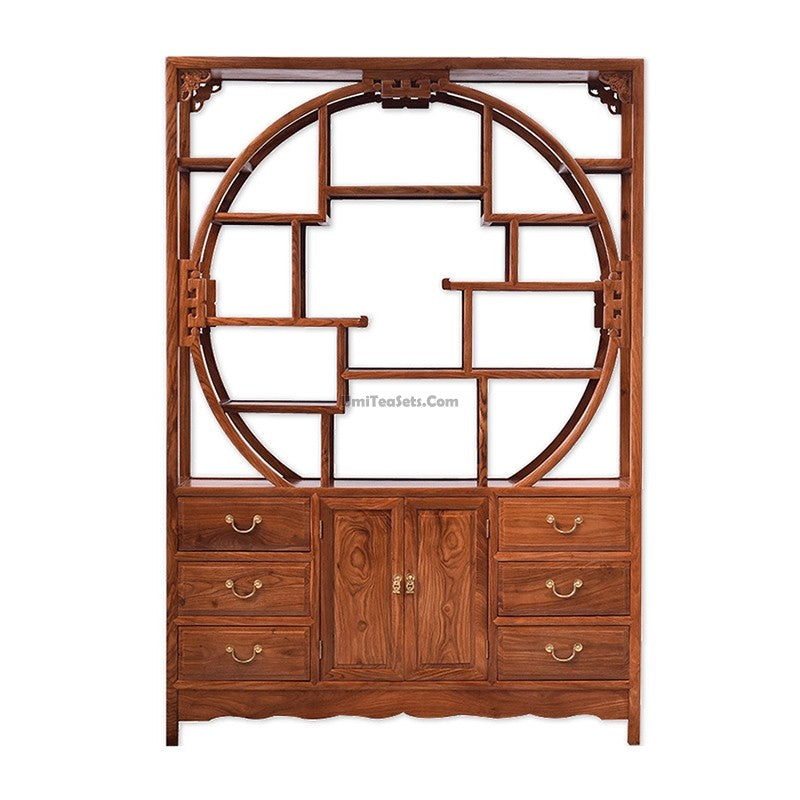 Angled view of the Pterocarpus wood curio shelf displaying a collection of antique tea sets.