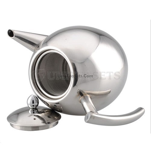 A close-up of the stainless steel teapot in use, pouring tea into a cup, demonstrating its functionality.