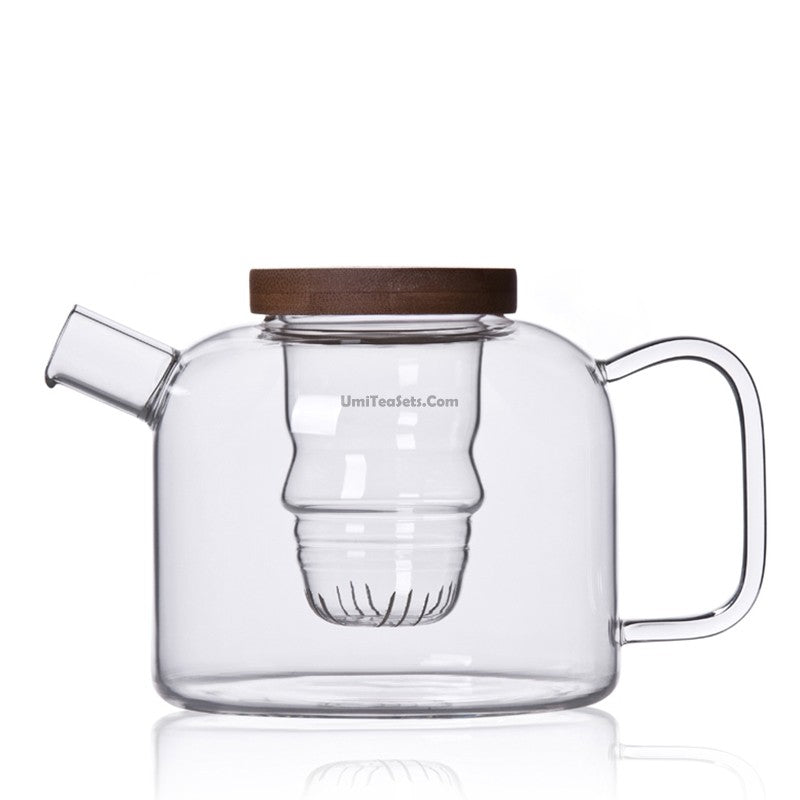 Elegant bamboo lid heat resistant glass teapot with strainer from a side angle, showcasing its design.