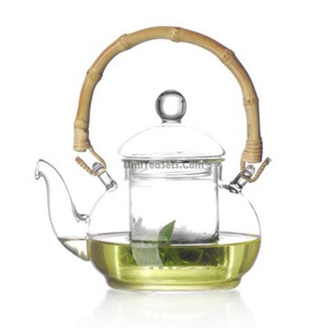 Elegant Bamboo Handle Glass Teapot with infuser and lid from a side view, showcasing its unique design.