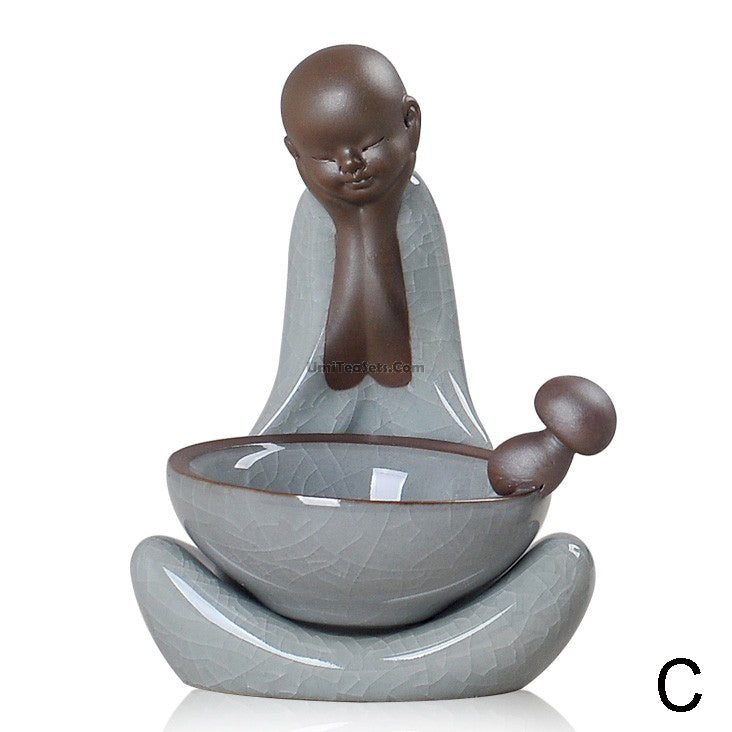 Front view of Ge Kiln tea infuser and holder set on a tea table