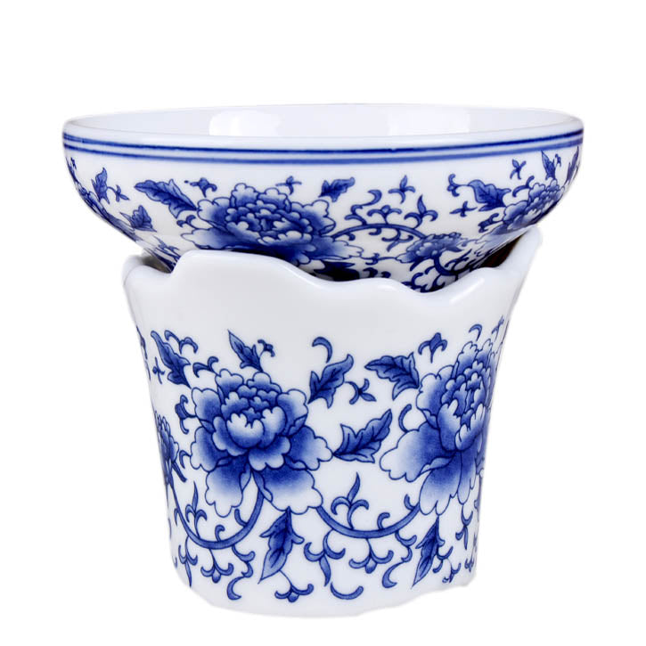 Elegant Blue Peony tea strainer resting on a porcelain holder, ideal for loose leaf tea brewing.