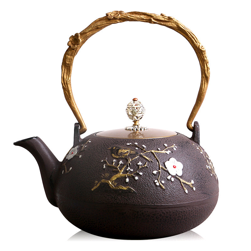 Elegant Japanese plum cast iron teapot showcasing the copper ring handle and flower bud lid.