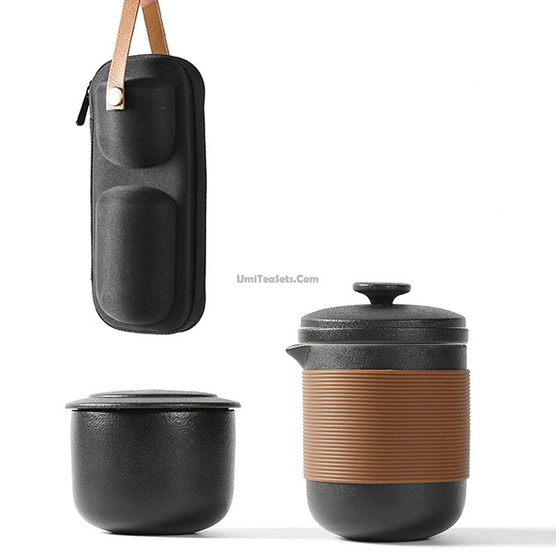 Elegant Black Ceramic Travel Tea Set displayed with teapot and cups, perfect for outdoor adventures.