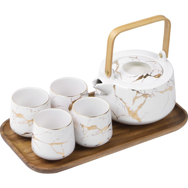 Front view of the Stone Stripes Modern Tea Set with marble and wooden accents
