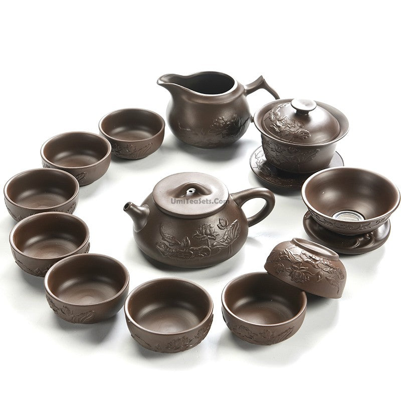 Close-up of Yixing purple clay lotus tea set with intricate lotus design
