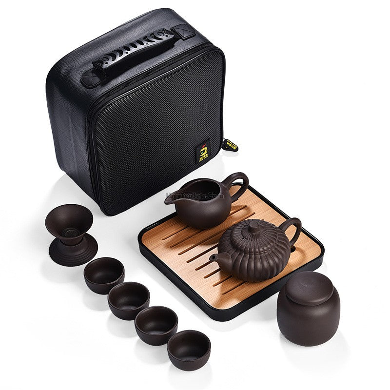 Yixing purple clay tea set placed on a wooden table, showcasing its elegant design.