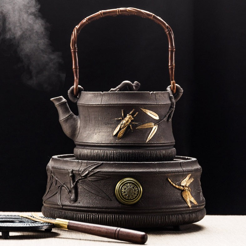 Bamboo cast iron teapot with induction cooker, front view showing bamboo design