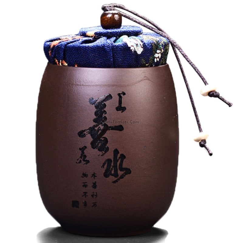 Elegant purple clay tea caddy showcasing Chinese characters, perfect for tea storage.